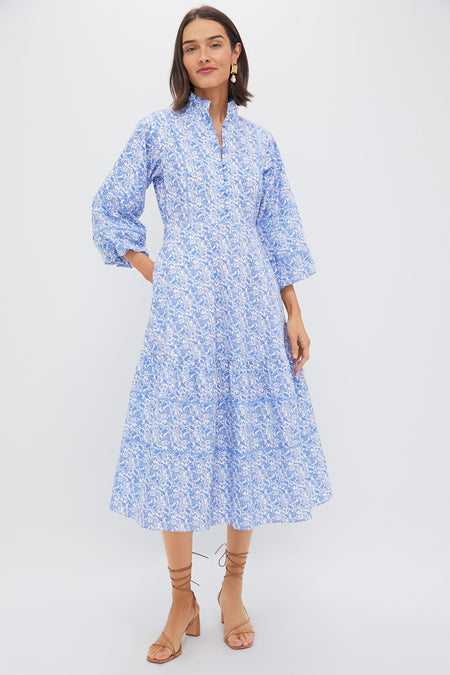 Playful Prints: Floral Shirt Tucked into Navy Chinos