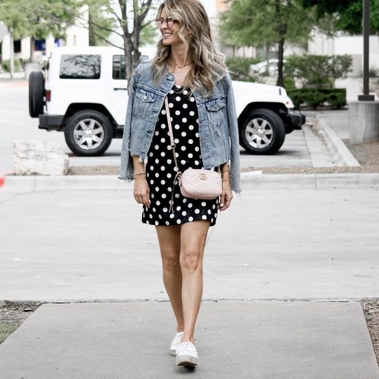 Playful Prints: Denim Jacket Over Polka Dot Dress and Sneakers
