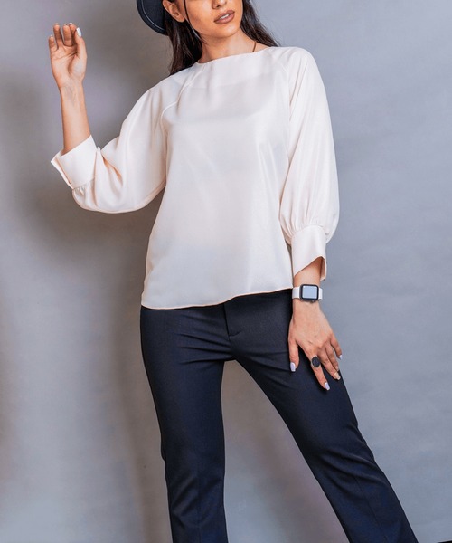 Soft Neutrals: Cream Blouse Paired with White Trousers