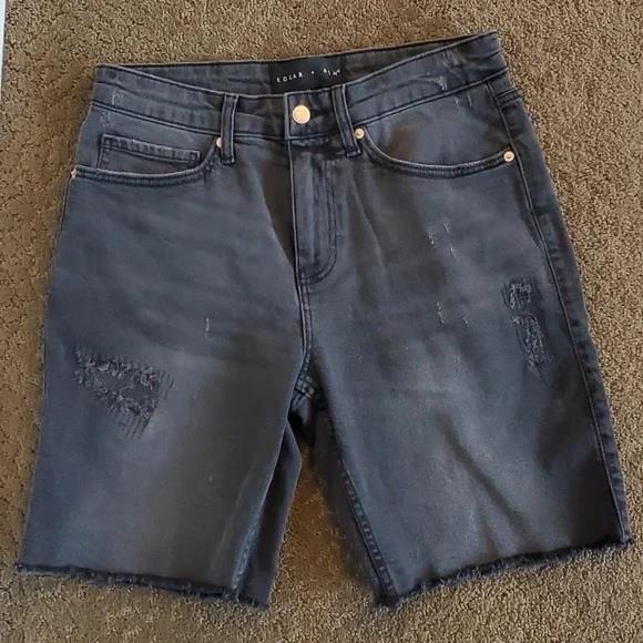 Edgy Appeal: Black Tank and Distressed Denim Bermudas