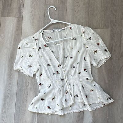 Fresh and Feminine: White Pants with Floral Peplum Blouse