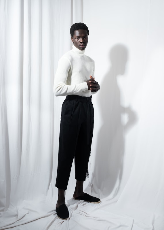 Urban Minimalism: White Slim Pants and Black Turtleneck