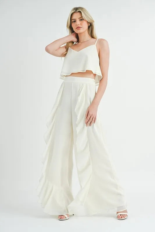 Sophisticated Evening Look: White Trousers and Satin Camisole