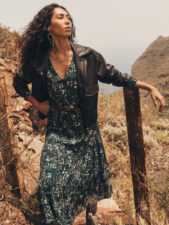 Layered Luxe: Denim Jacket Over Printed Maxi