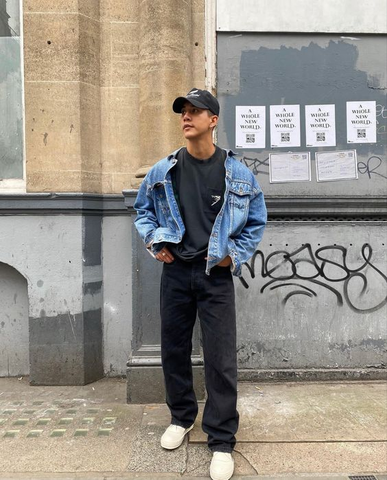 Urban Cool: Oversized Denim Shirt Layered Over Graphic Tee