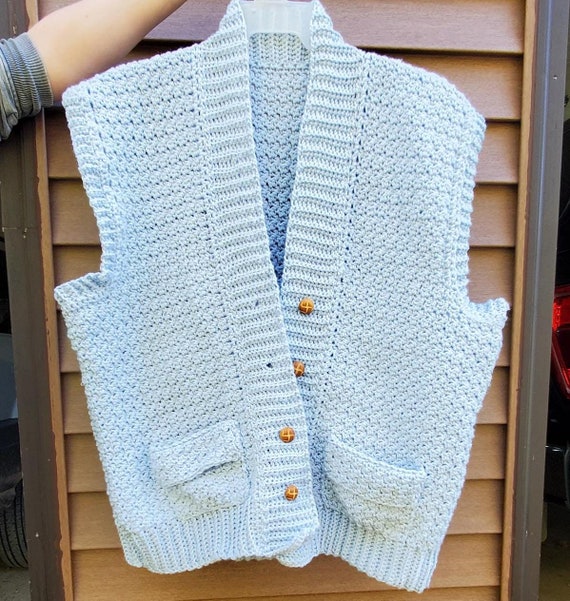 Layered Button-Up Shirt Beneath a Knit Vest