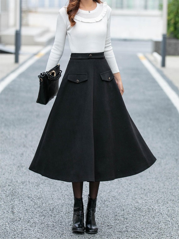Chic Minimalism with a White Turtleneck and Black Midi Skirt