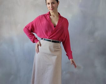 Bold Stripes Meet Neutral Skirt for Effortless Style