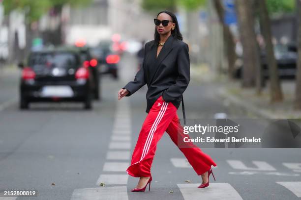 Edgy Glam: Black Sweatpants with Bold Red Lip and Heels