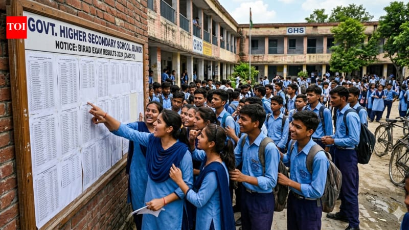 Students looking at their exam results on a computer screen