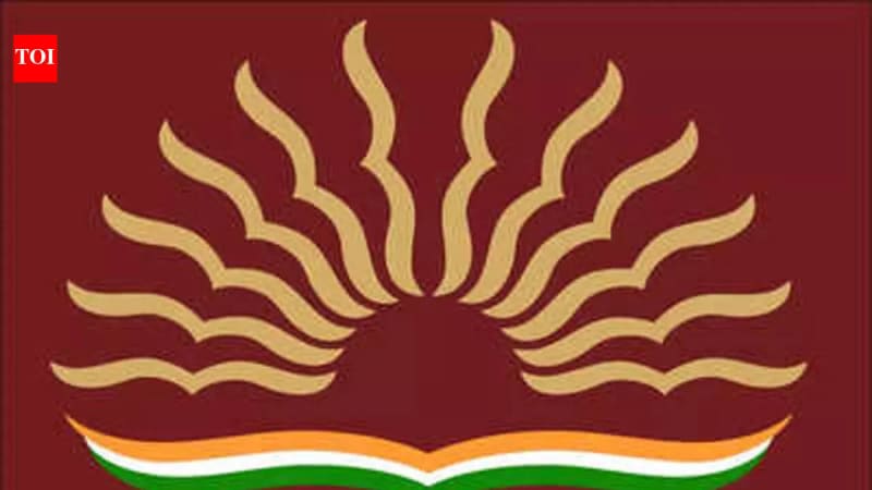 A parent helping a child with an online application on a laptop, symbolising the KVS admission process.