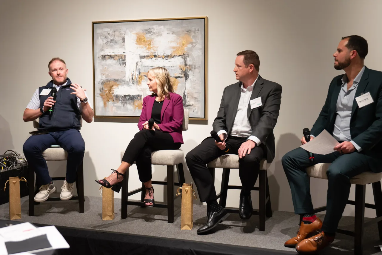 A photo of Jeremy Roberts, Laurie Oswald, Matt Clark, and Garrett Mintz