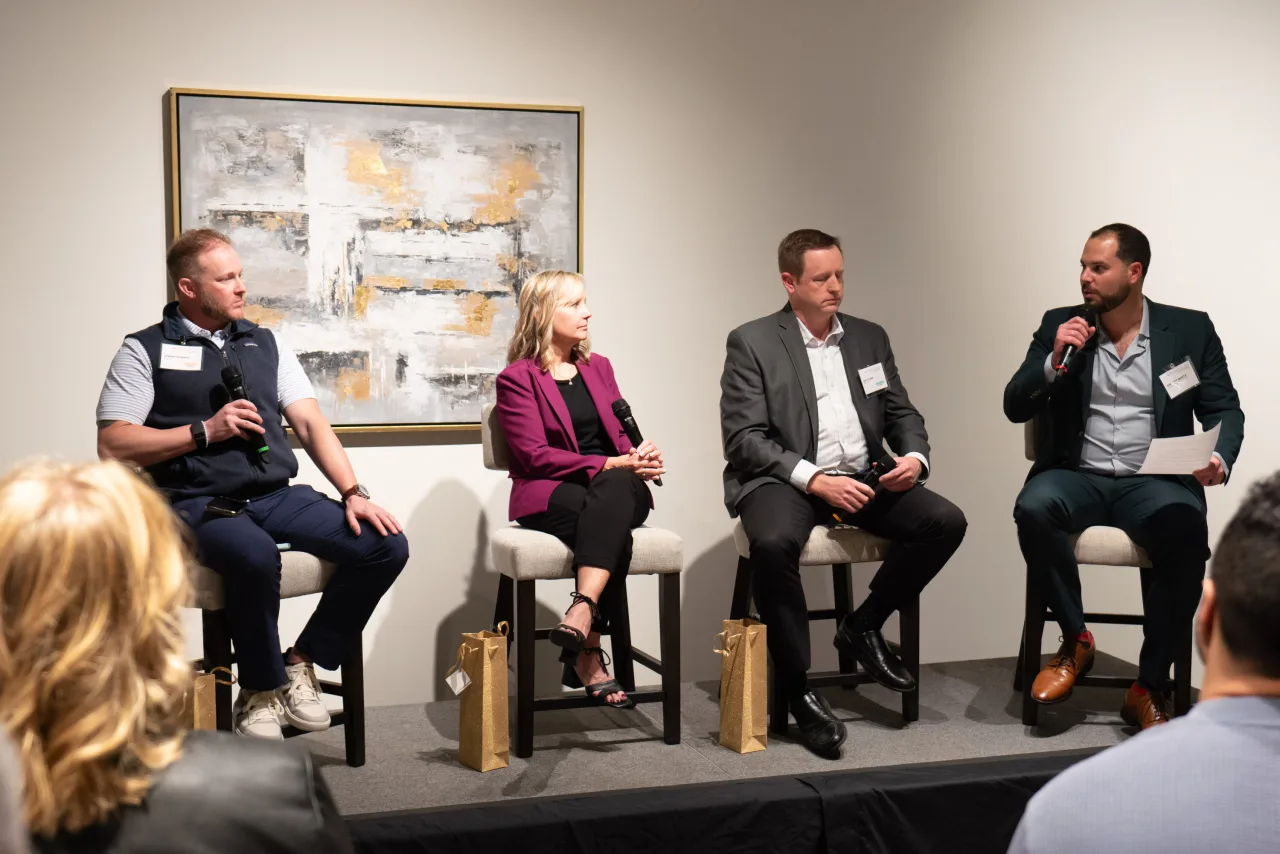 A photo of Jeremy Roberts, Laurie Oswald, Matt Clark, and Garrett Mintz