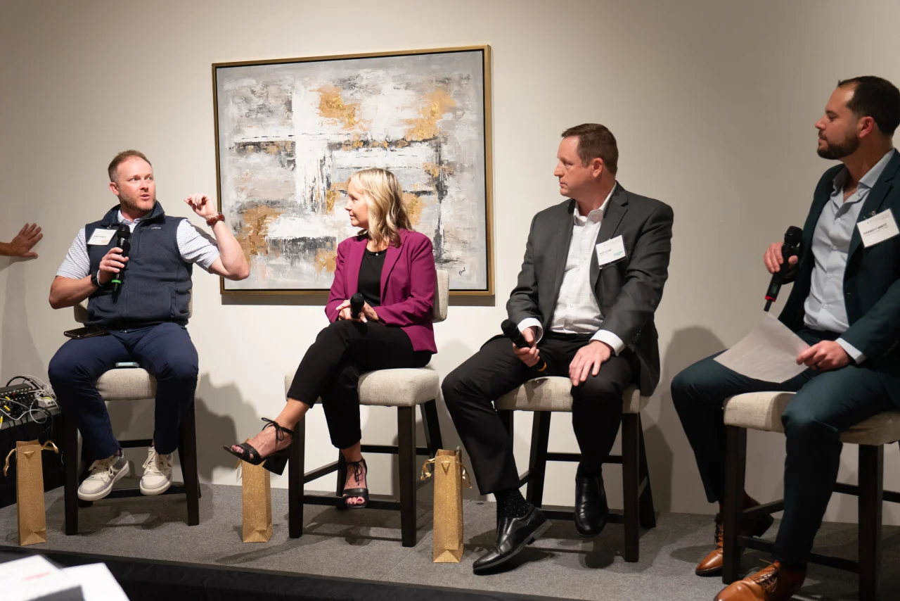 A photo of Jeremy Roberts, Laurie Oswald, Matt Clark, and Garrett Mintz