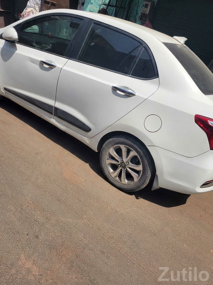 White Compact Sedan with Alloy Wheels White Compact Sedan with Alloy Wheels
