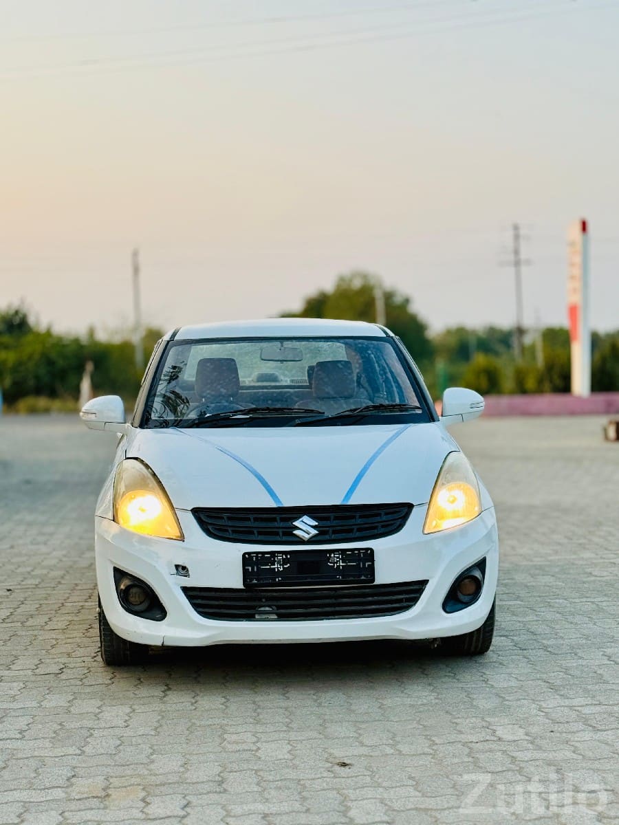 White Maruti Swift Dzire Sedan Car White Maruti Swift Dzire Sedan Car