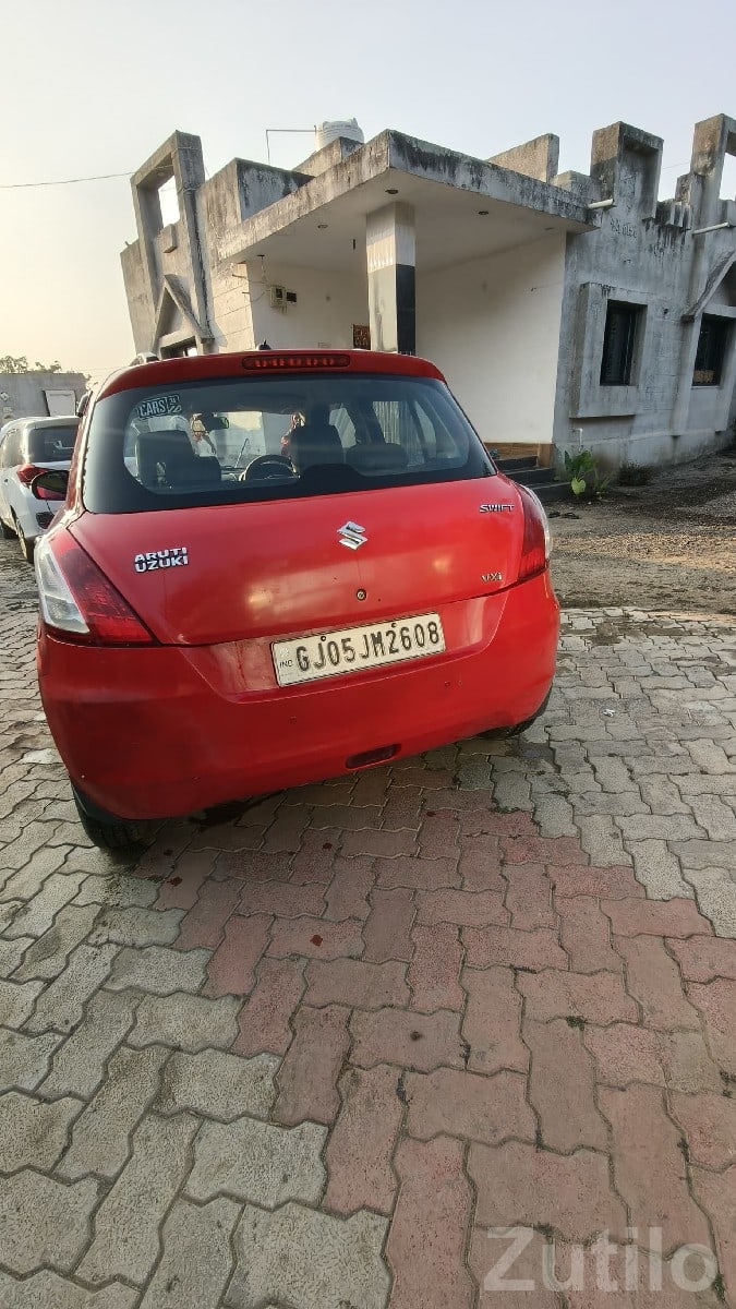 Red Maruti Swift VDI Diesel Hatchback Red Maruti Swift VDI Diesel Hatchback