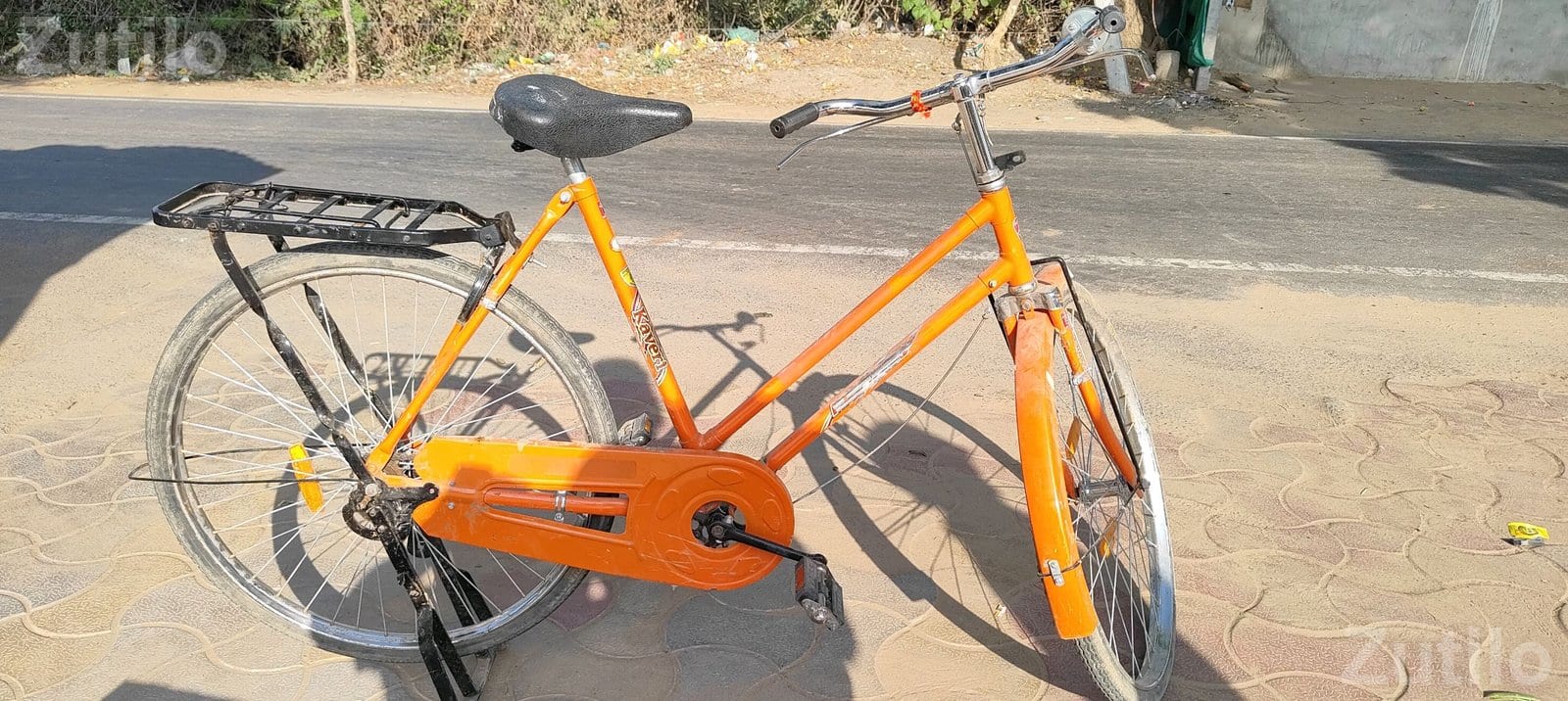 Orange Roadster Bicycle with Carrier