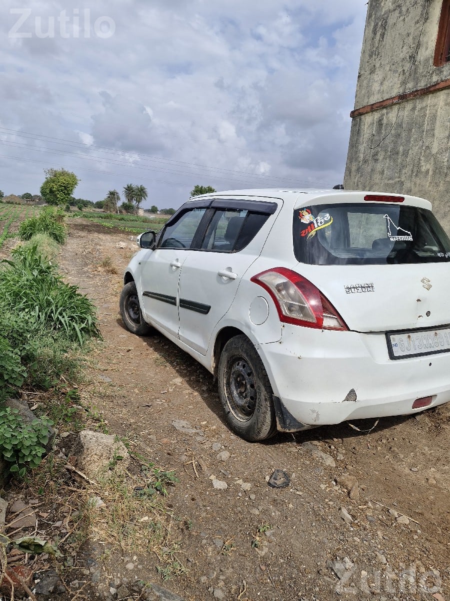 2015 Maruti Suzuki Swift White Hatchback 2015 Maruti Suzuki Swift White Hatchback