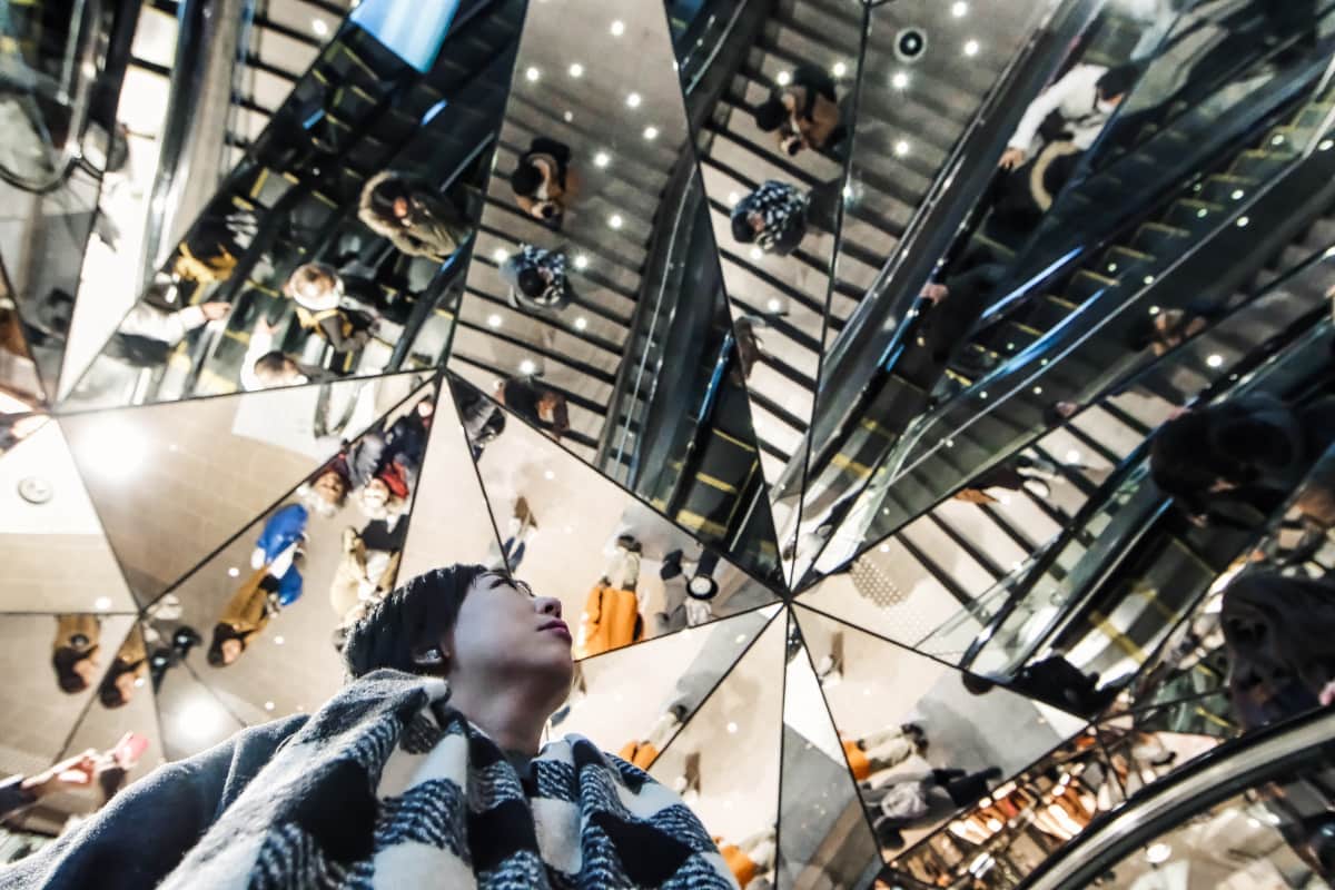 Triangular mirrors on the ceiling of an entrance in a mall