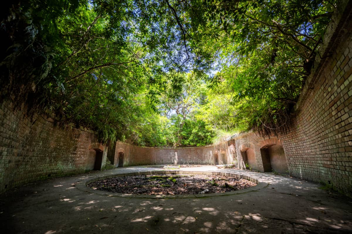 Tomogashima Island brick fortress ruins surrounded by dense forest in Wakayama