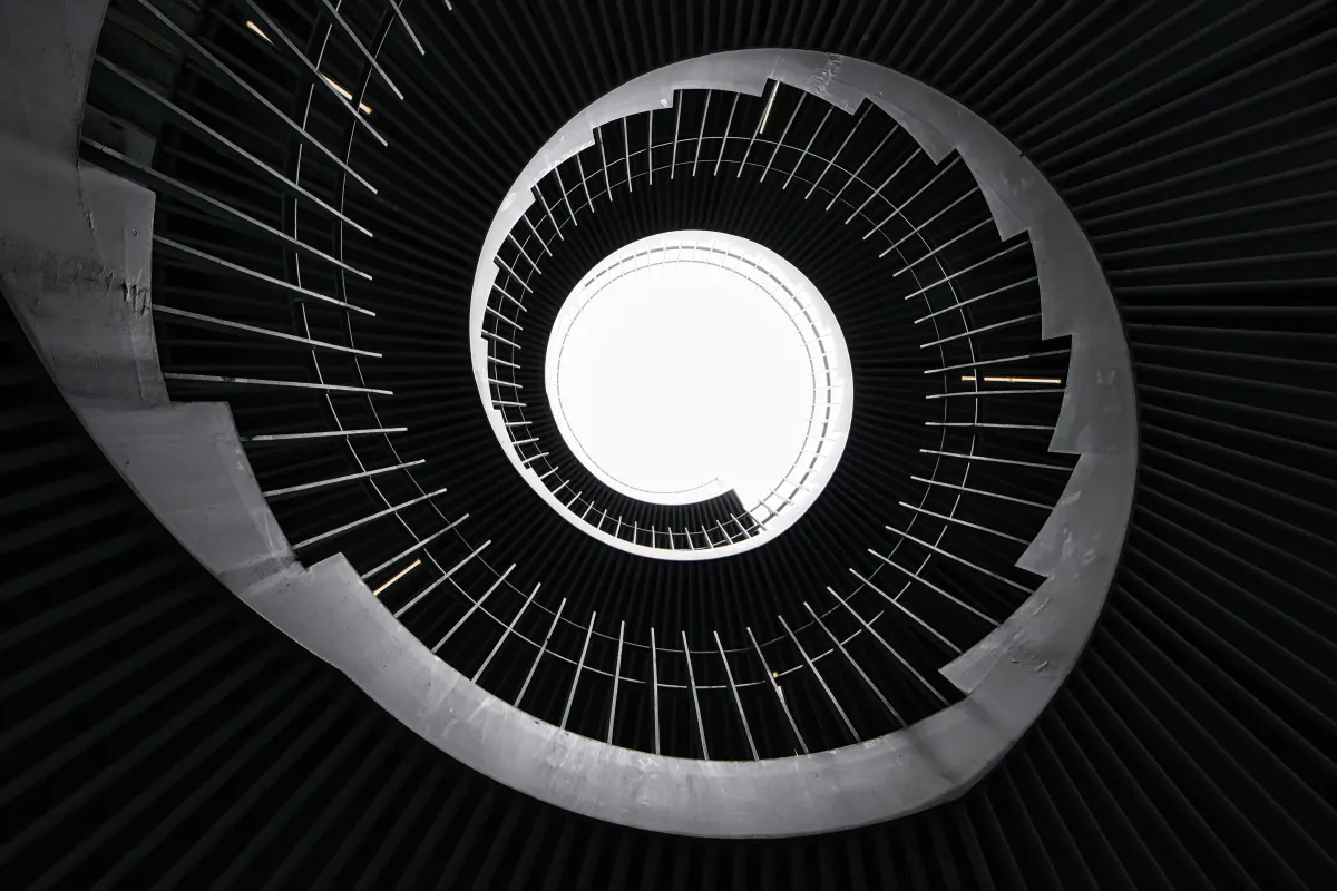 Black gear-shaped spiral staircase taken from below