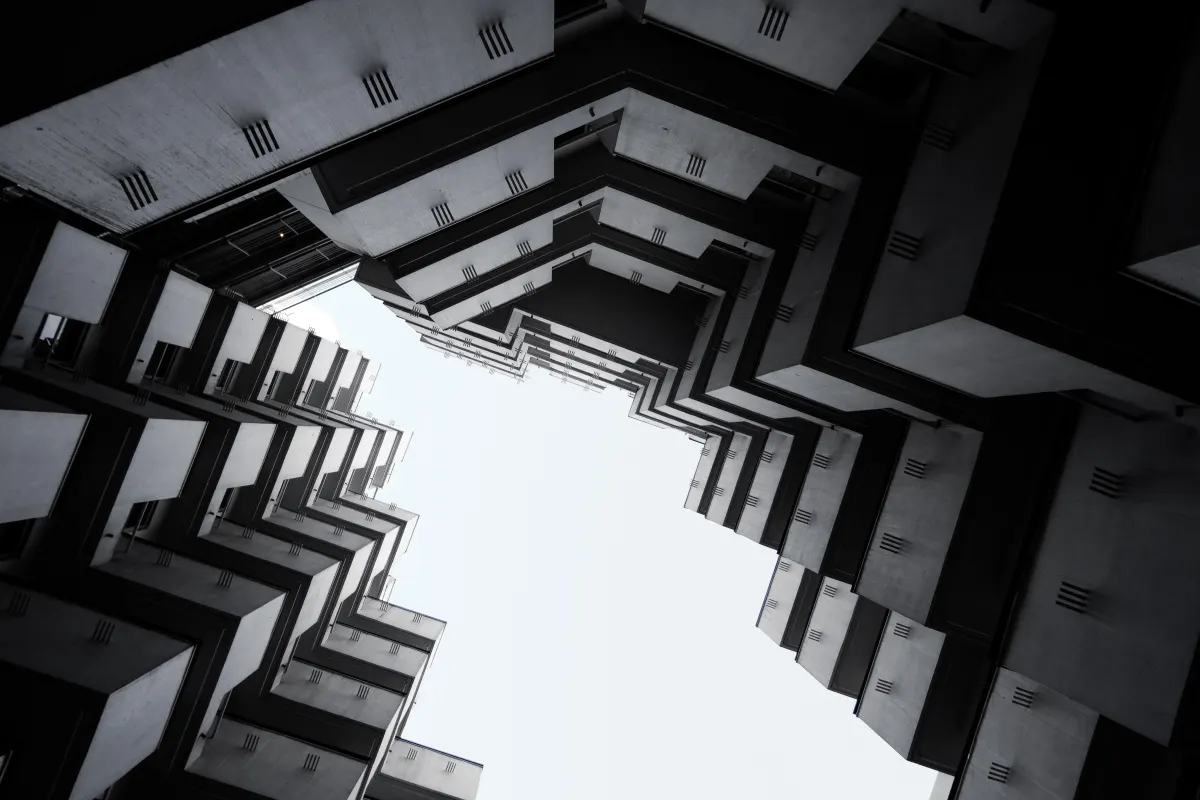 A look up of a zigzag shaped facade of a building in Tokyo