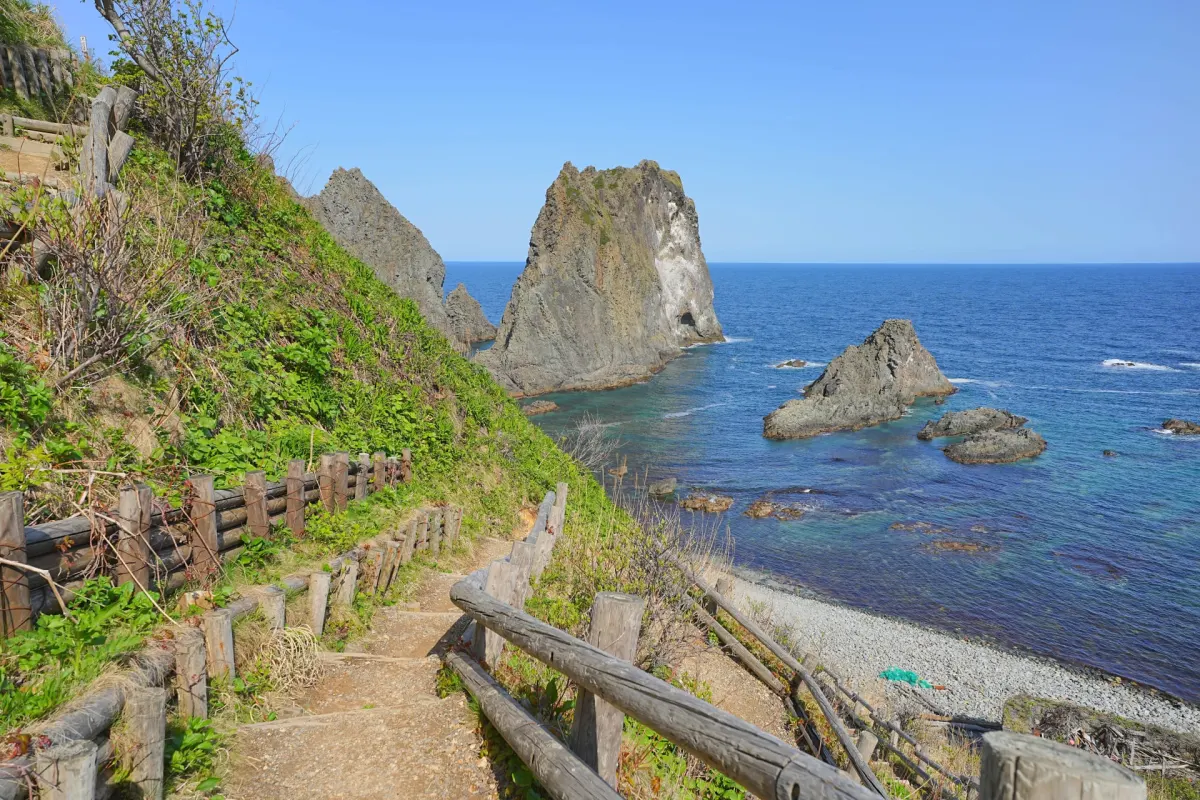 Coastal cliffs and turquoise waters at Shimamui Coast in Hokkaido