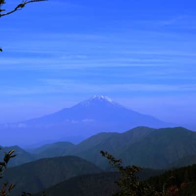 Mount Mitsutoge hiking trail with forests, rocky paths, and Mount Fuji views.