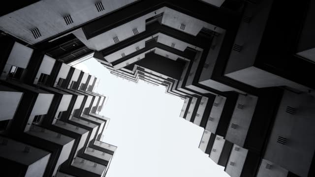 A look up of a zigzag shaped facade of a building in Tokyo
