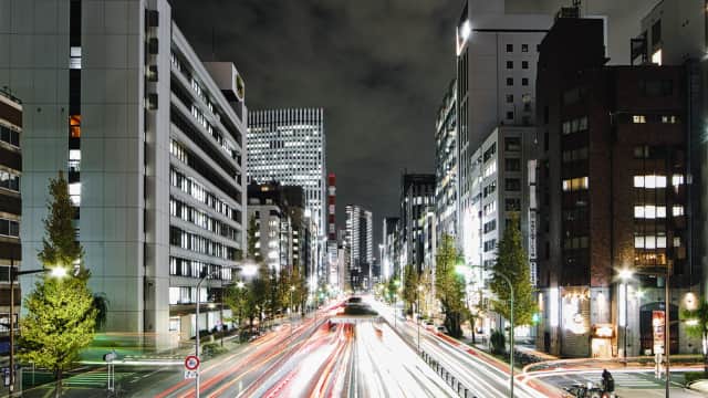 Red and white light trails from cars passing by in Tokyo