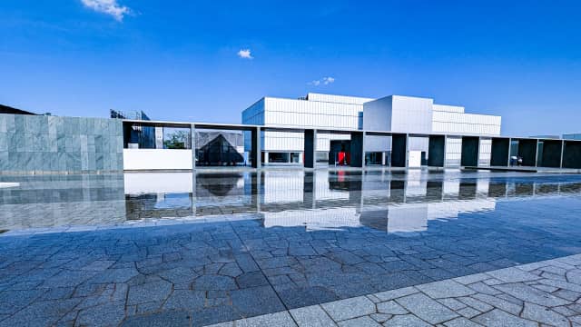 Modern museum building with glass walls and reflecting pool - Toyota Municipal Museum of Art