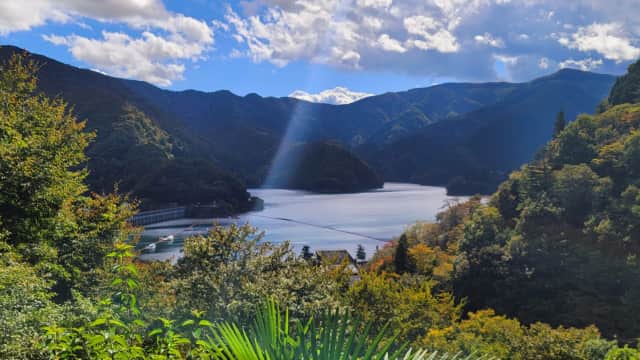 Lake Okutama with emerald water and mountain scenery