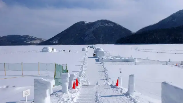 Snow and ice village built on a frozen lake in Hokkaido during winter