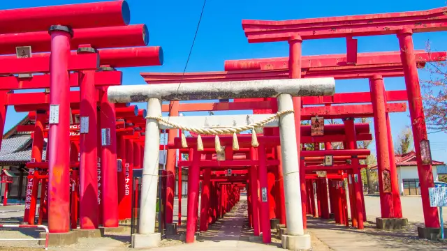 Vermilion torii gates forming tunnels at Koizumi Inari Shrine in rural Gunma