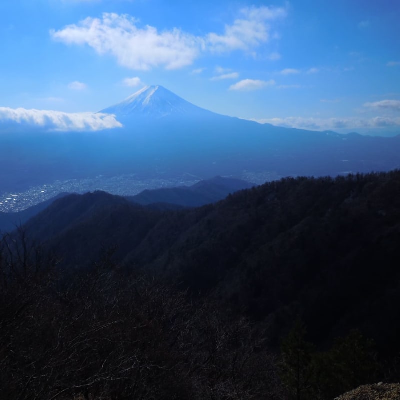 Mount Mitsutoge hiking trail with forests, rocky paths, and Mount Fuji views.