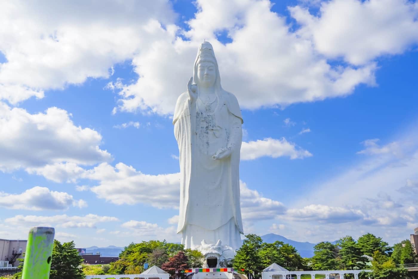 Sendai Daikannon, a towering white Buddhist statue in Sendai, Japan, featuring temple grounds, panoramic city views, interior Buddhist statues, spiral staircases, and peaceful spiritual spaces at Daikanmitsuji Temple.