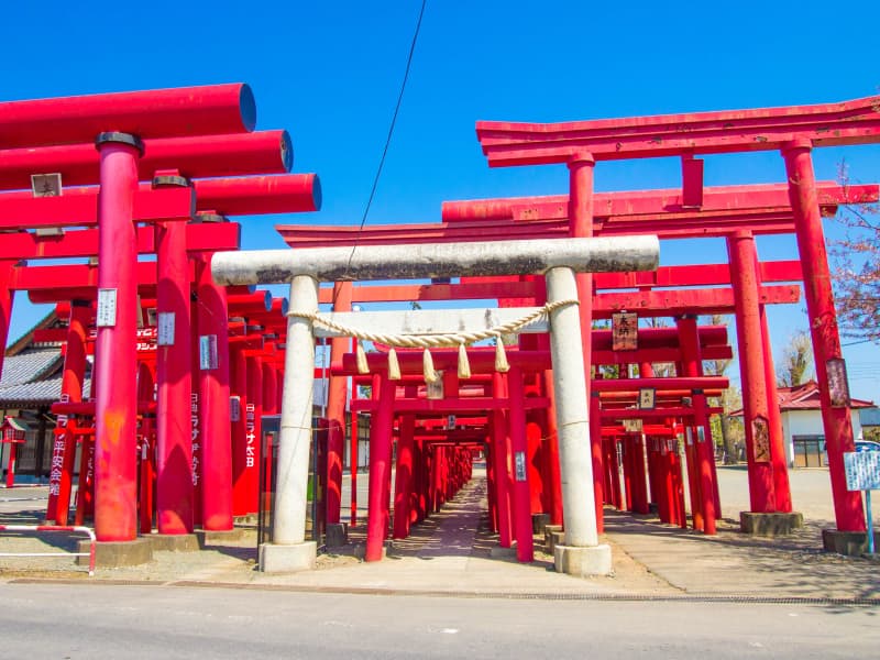 Vermilion torii gates forming tunnels at Koizumi Inari Shrine in rural Gunma