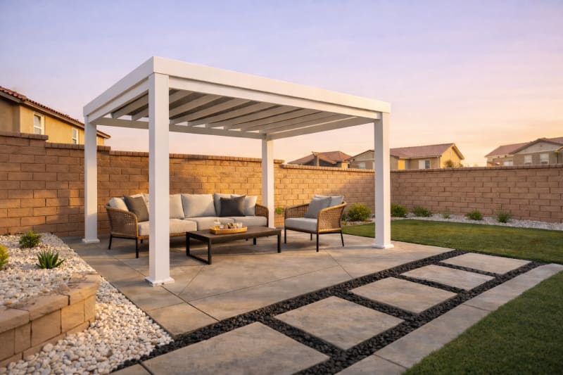 Modern white pergola over a concrete patio with outdoor sofa set