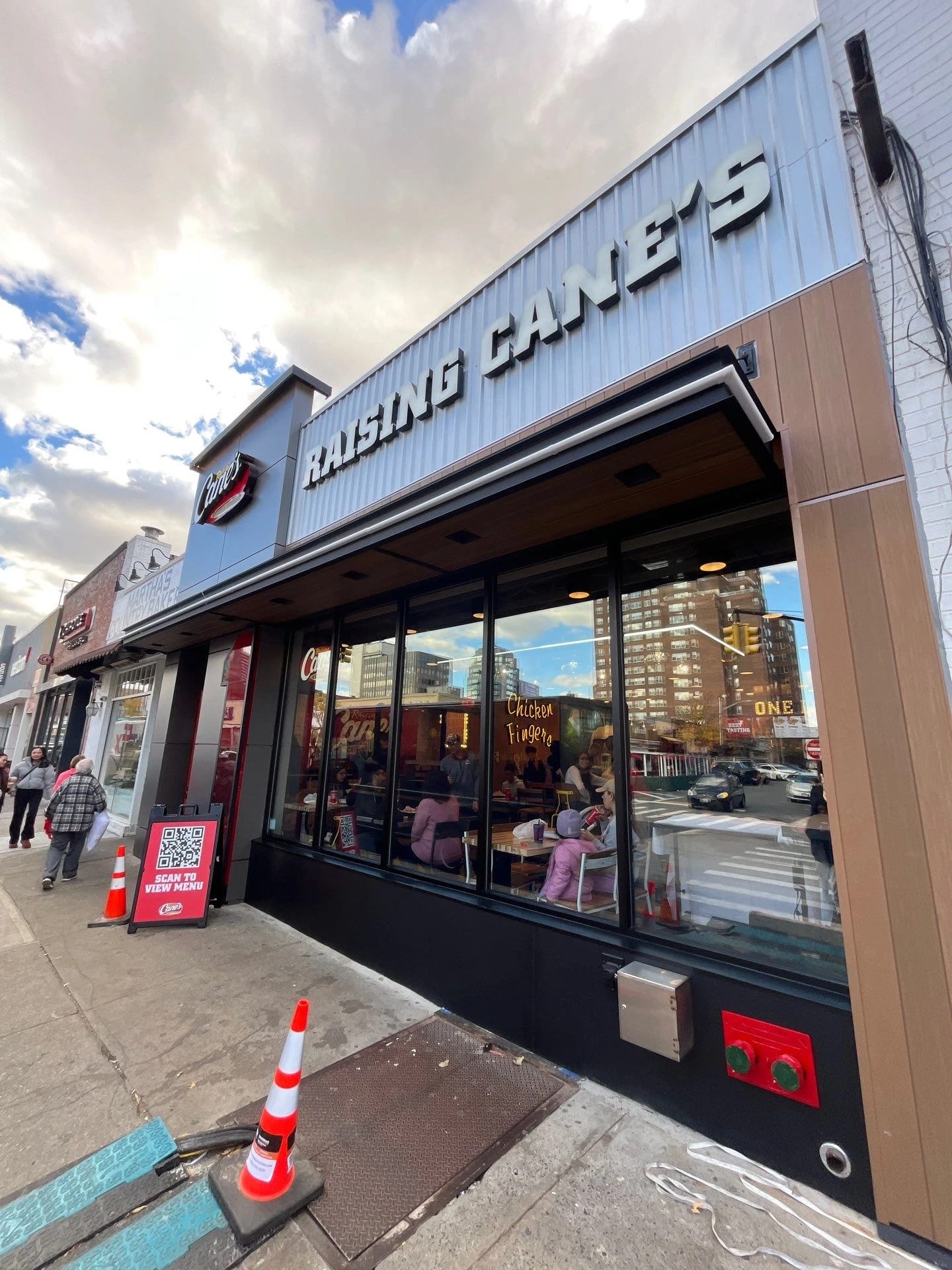 Completed Raising Cane’s storefront in Forest Hills
