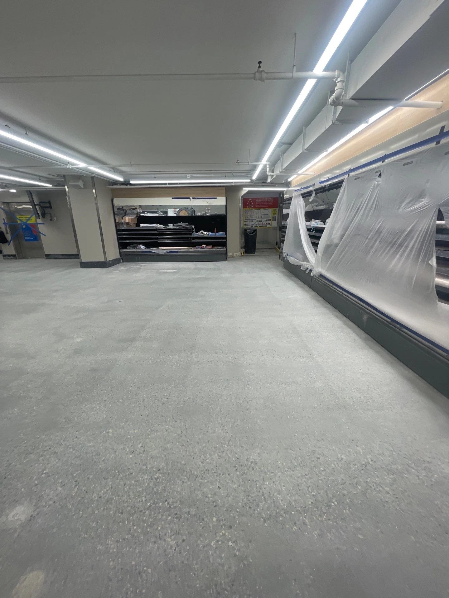 Polished concrete sales-floor aisle at Lidl Harlem