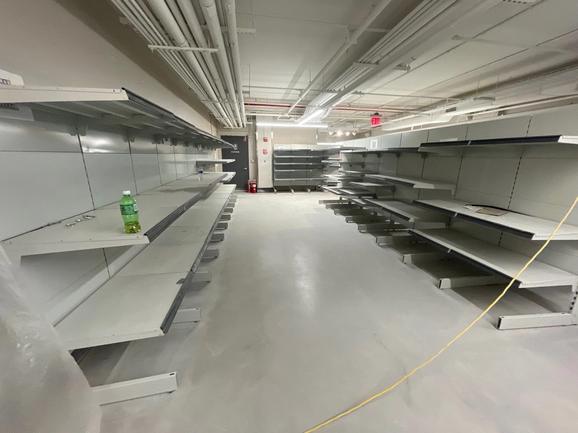 Polished concrete floor beneath the retail shelving