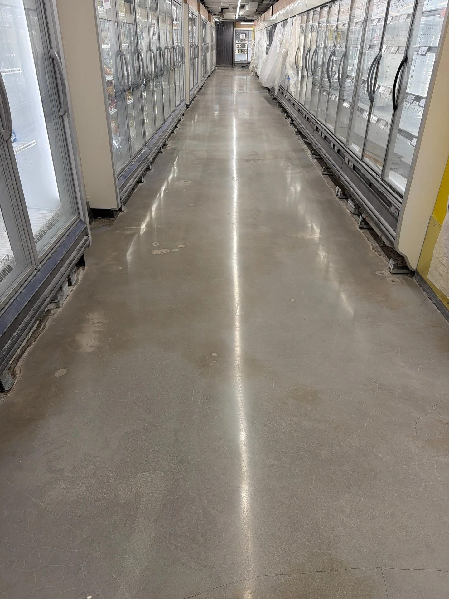 Polished concrete floor along the refrigerator aisle