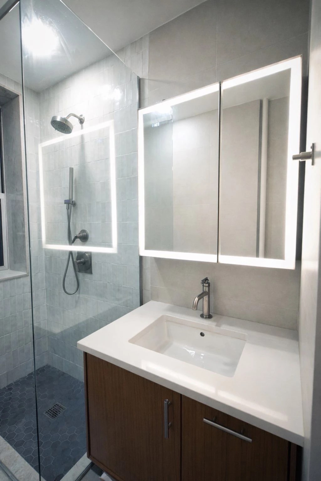 Renovated apartment bathroom with vanity and mirror