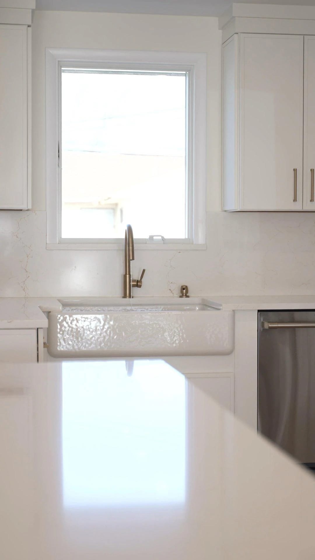 Kitchen sink and countertop in the renovated Plainview home