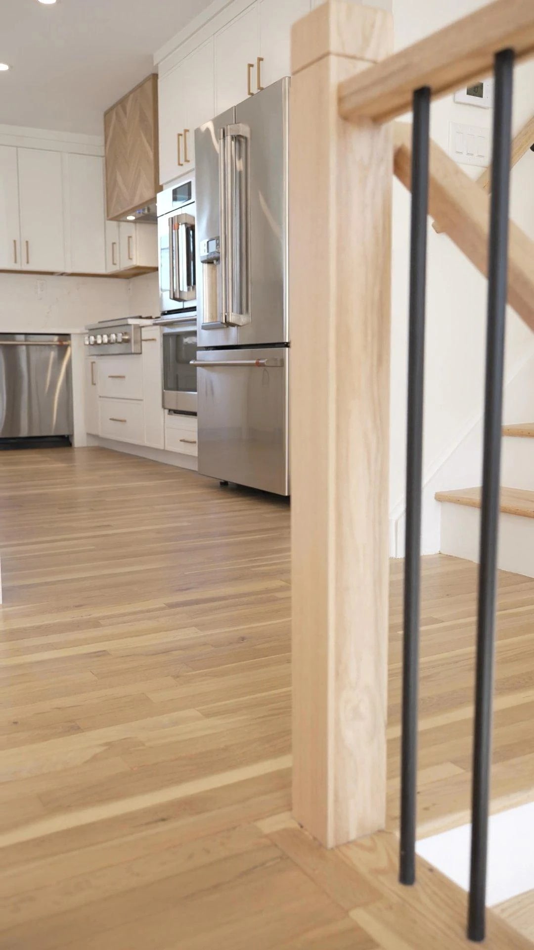 Renovated kitchen and adjoining timber stair rail