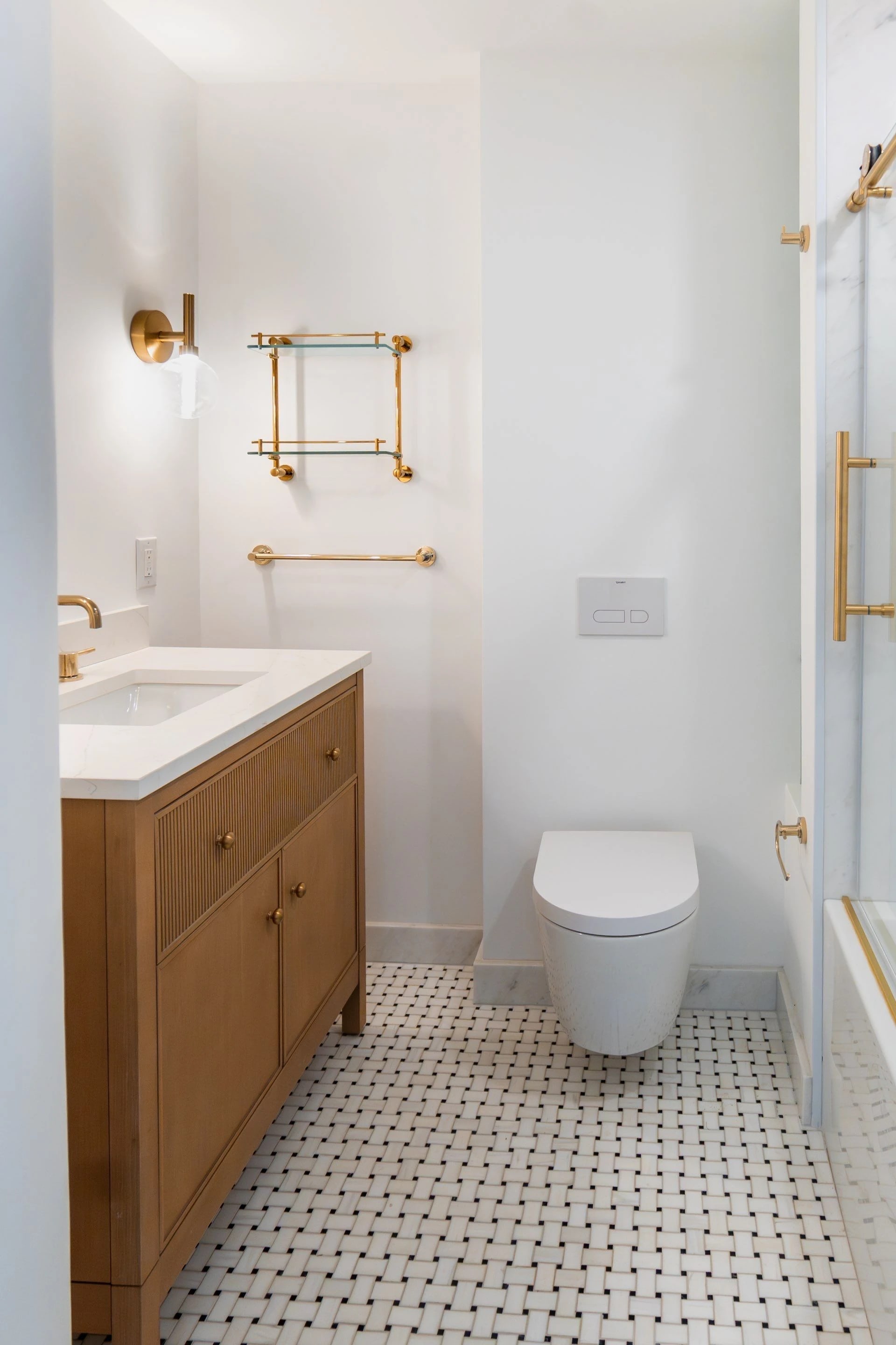 Renovated bathroom and toilet in the Tribeca apartment