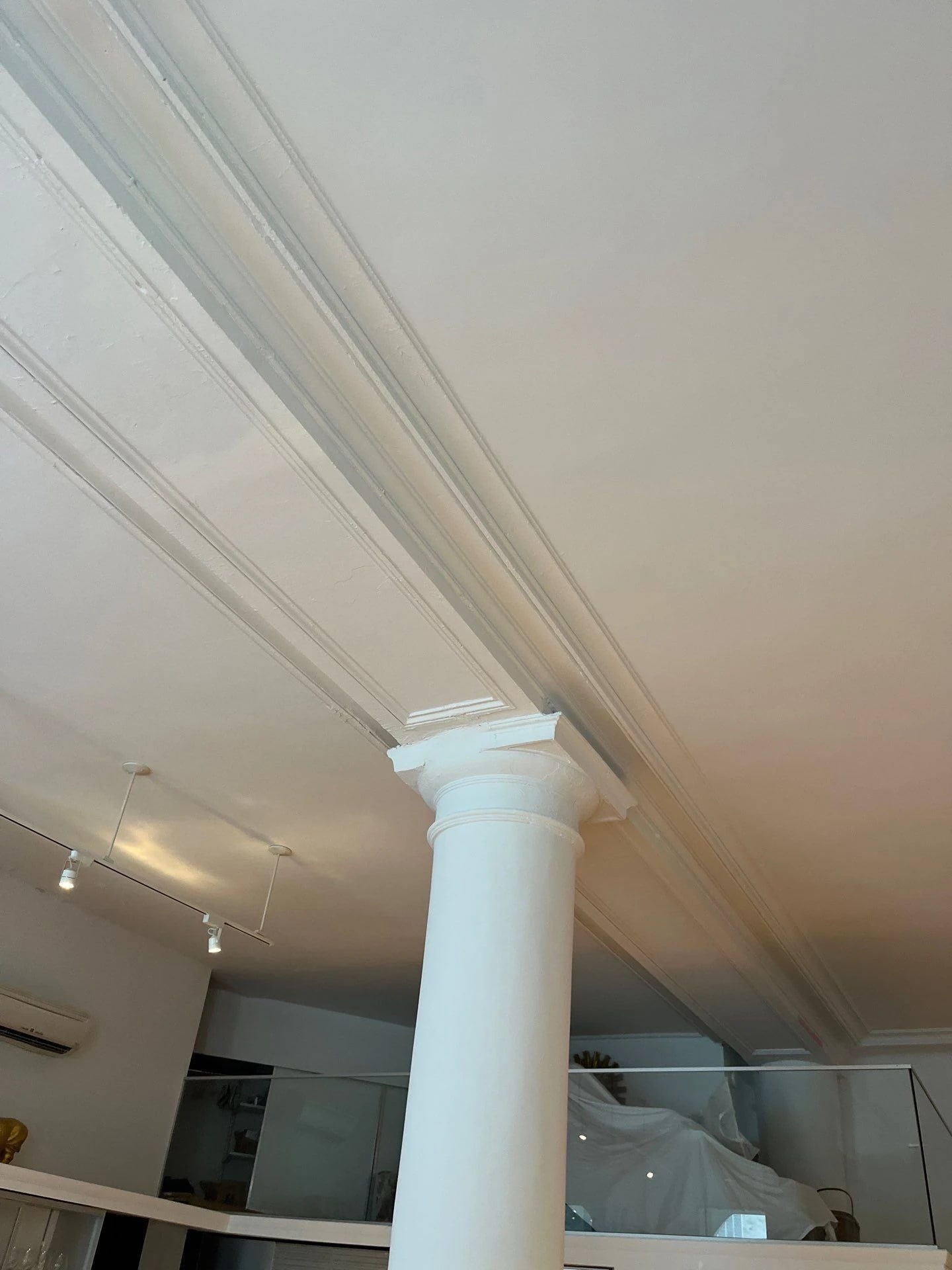 Painted column and cornice details in the refreshed apartment