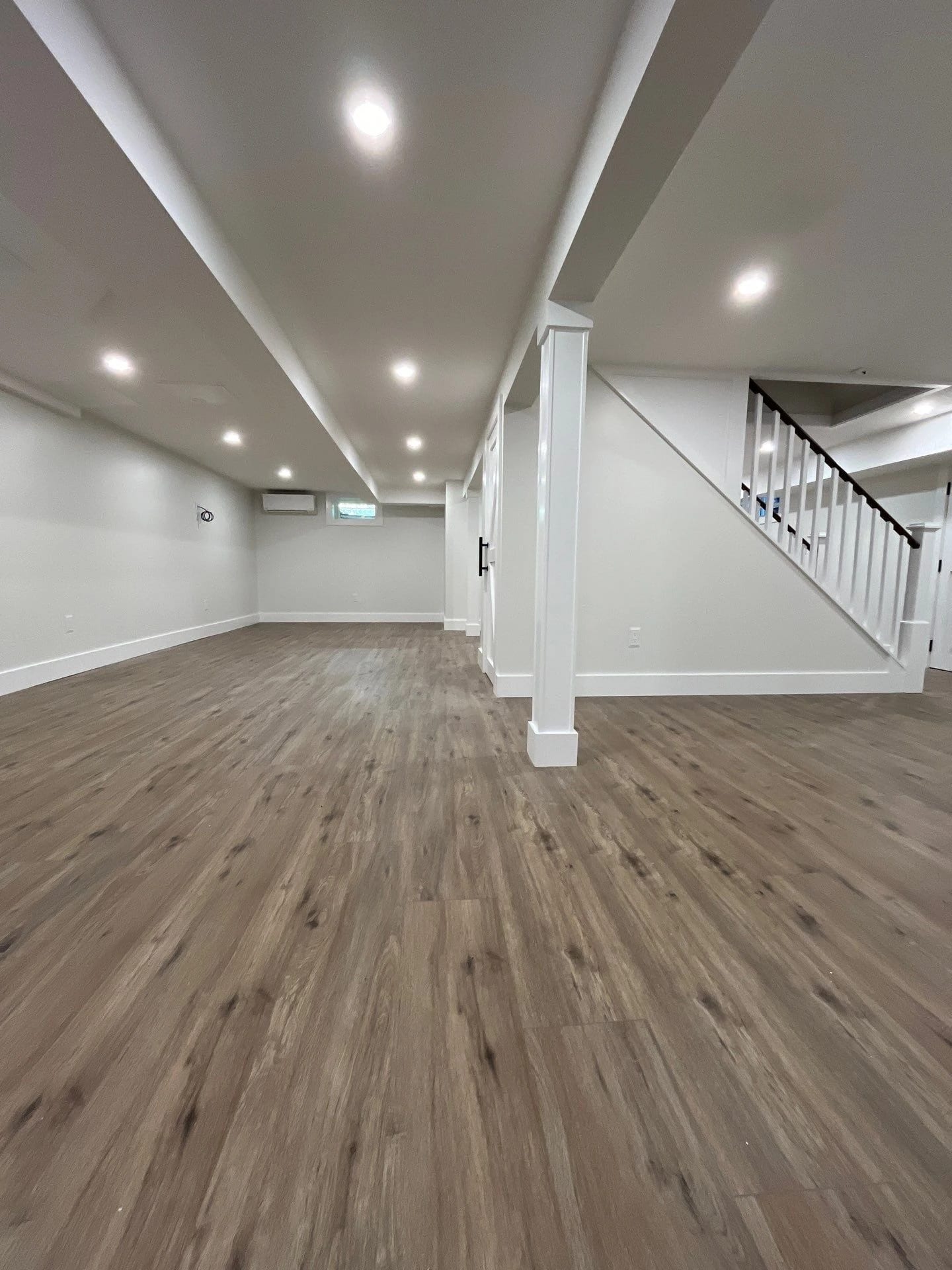 Wide view of the finished basement in Hicksville