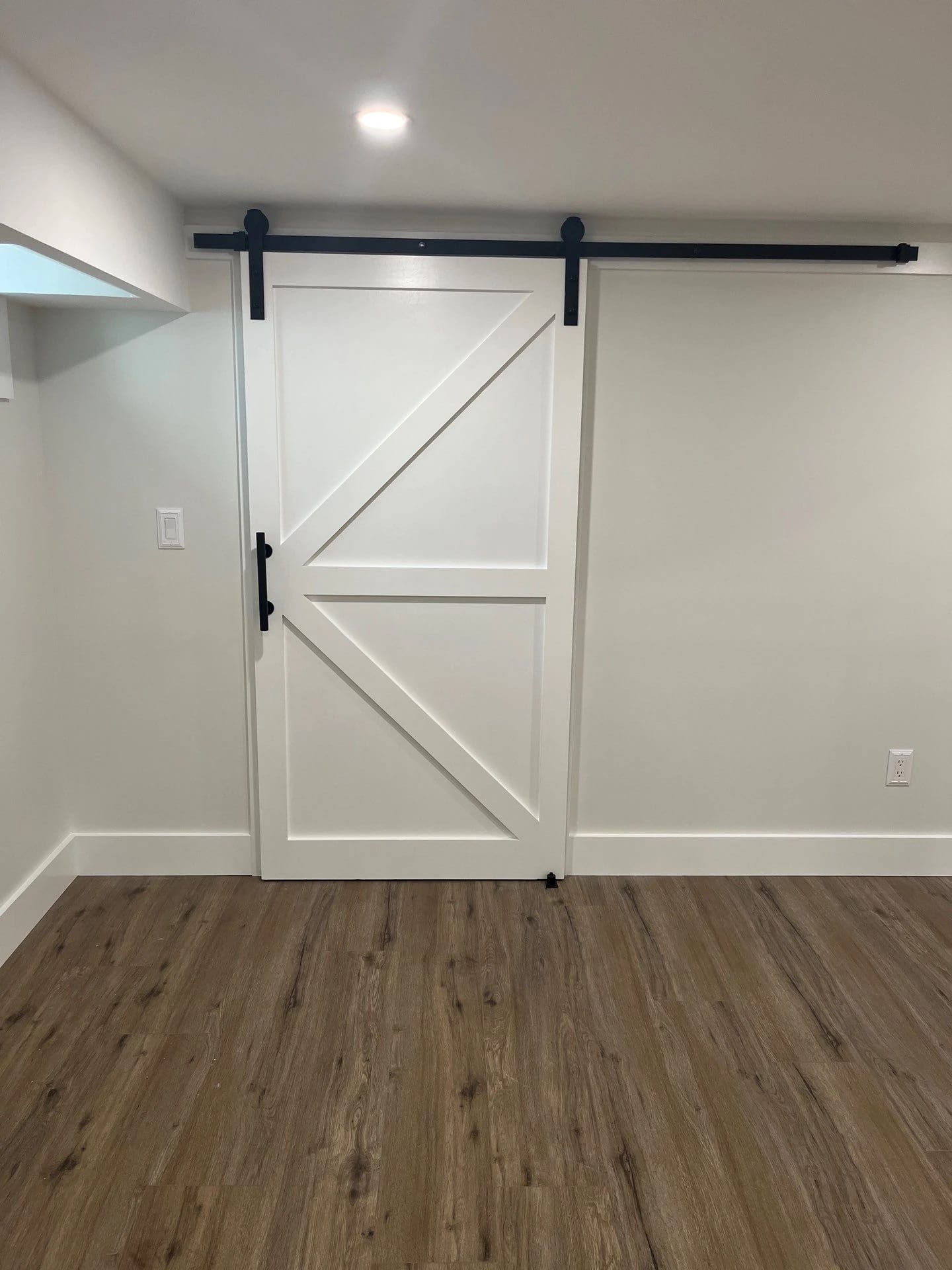 Sliding barn door in the renovated basement